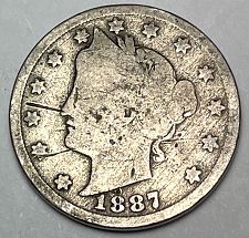 1887 Liberty Nickel lamination error showing surface peel and planchet split on the coin face